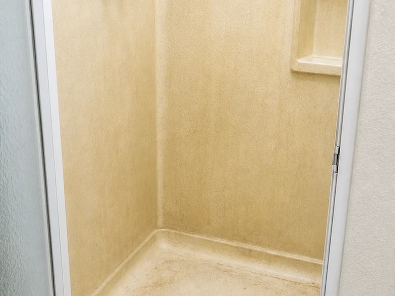 Yellowed crazed fiberglass shower stall with soap scum before refinishing, Lawrence Station condo, Santa Clara