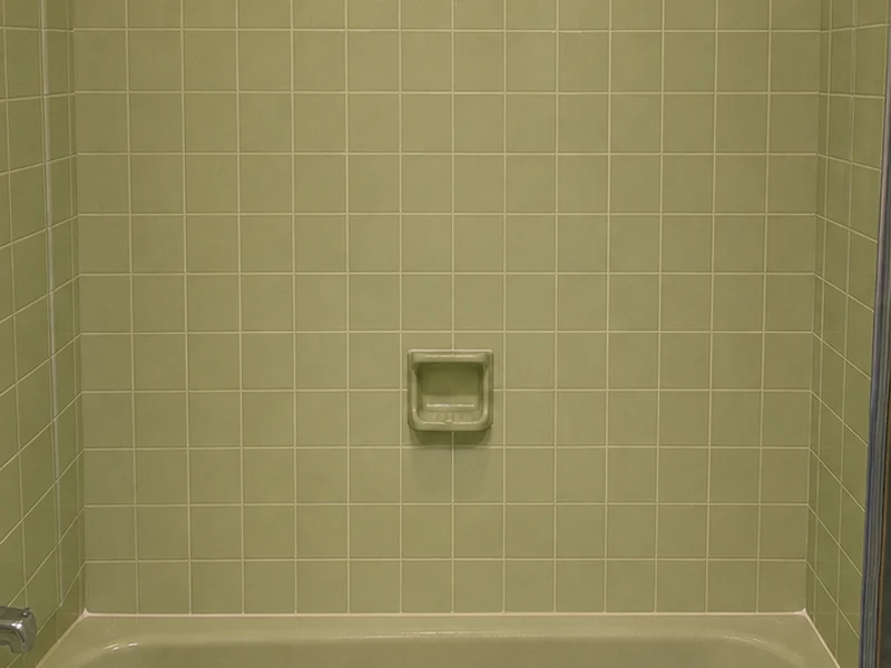 Dated avocado-green tub-surround tile before reglazing, Forest Park home, Santa Clara